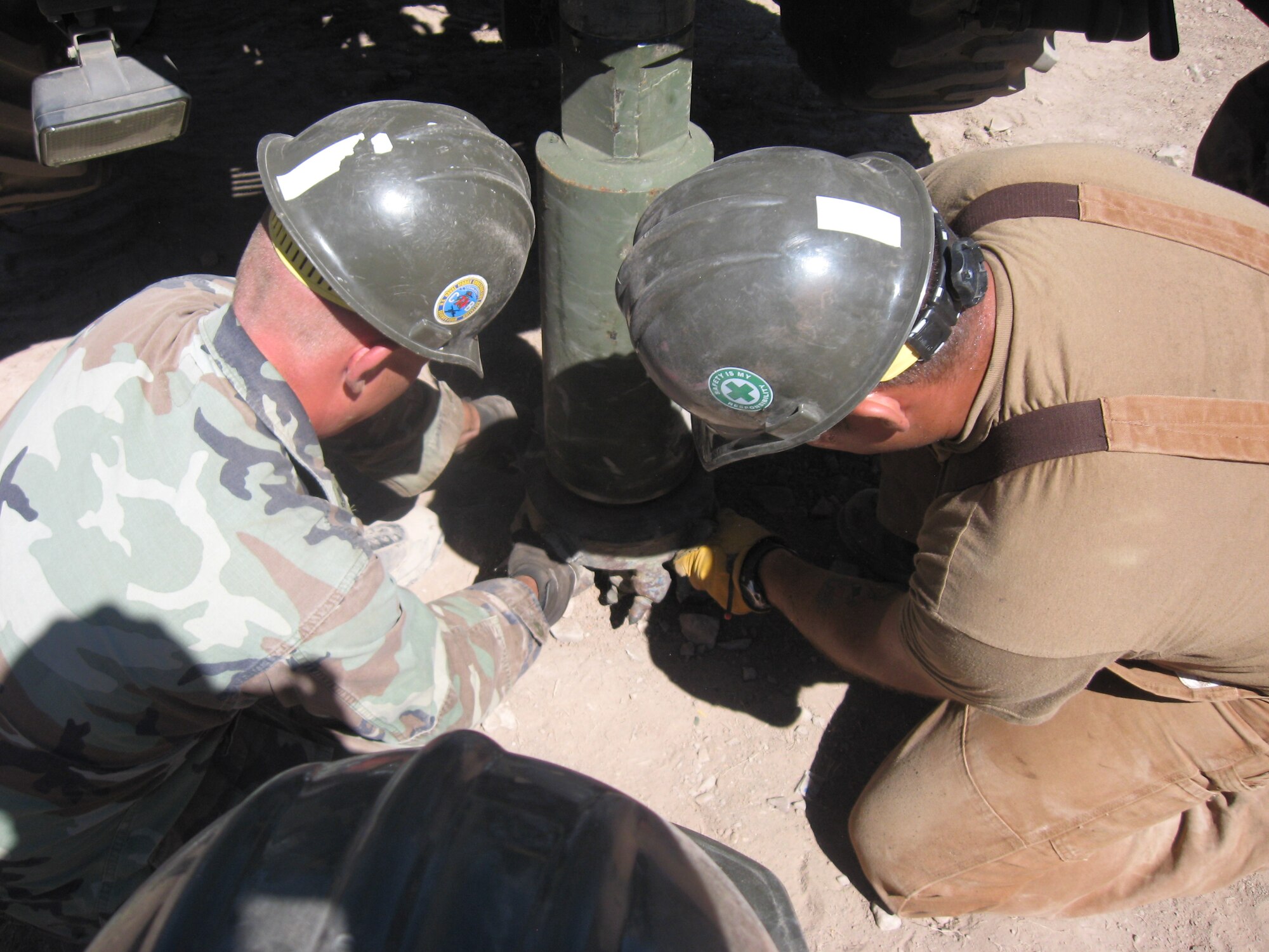 U.S. Navy Seabees, construction mechanic deployed from Gulfport, Miss., install a drill bit used to create a well in Huanta, Peru, June 6, in support of New Horizons Peru 2008, a humanitarian mission that benefits underprivileged Peruvians. U.S. Air Force, Army, Marines, and Navy servicemembers came together for this effort to build new schools, clinics, and water wells which will accommodate nearly 5,200 Peruvians. (U.S. Navy photo/ Chief Petty Officer Matthew Turner)