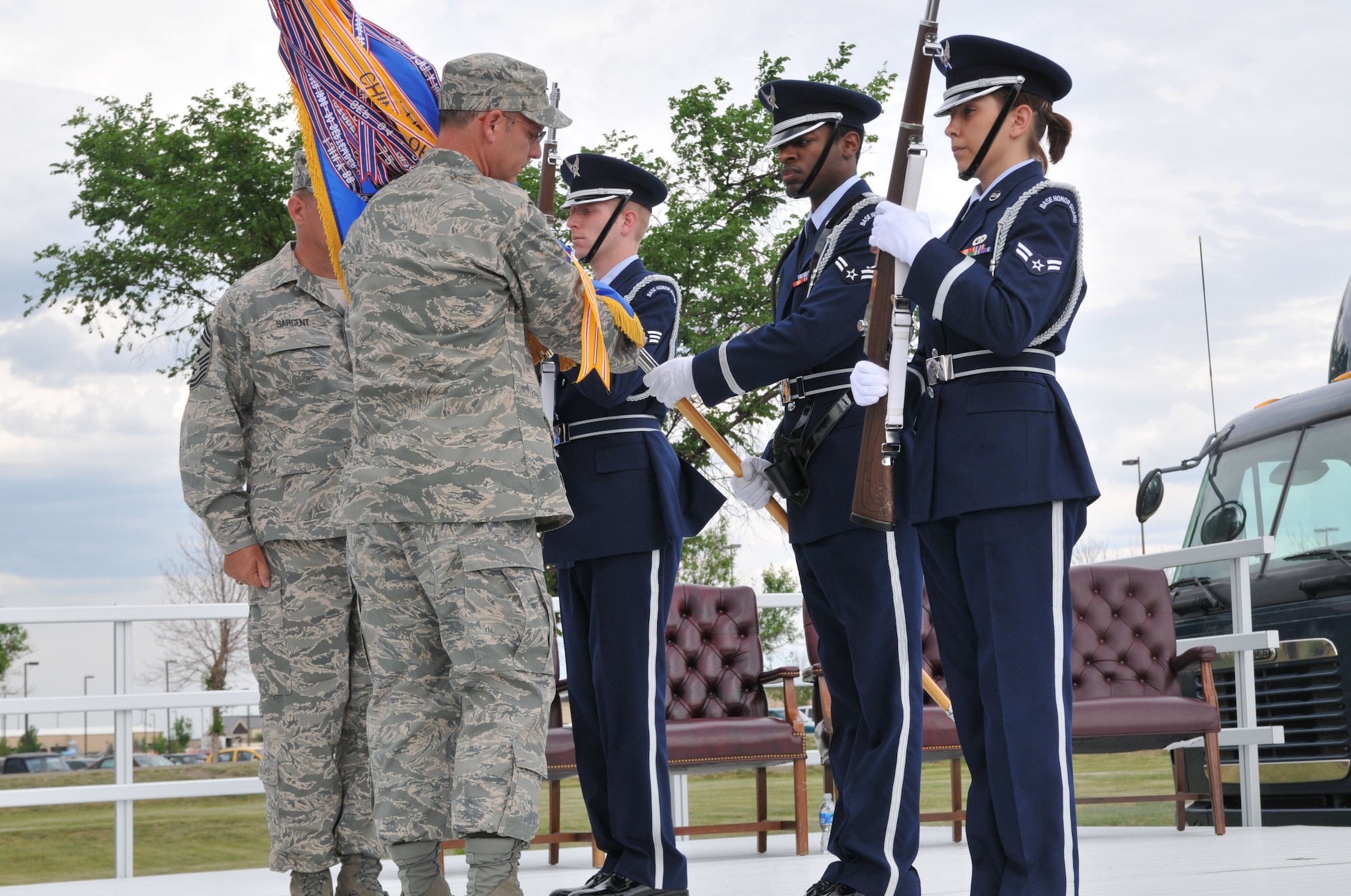 Members of the Honor Guard present the new missile wing flag to Col. Michael Fortney, 341st Missile Wing commander, for inspection. A ceremony was held July 1 at Medal of Honor park to re-designate Malmstrom as the 341st MW. (U.S. Air Force photo/John Turner)