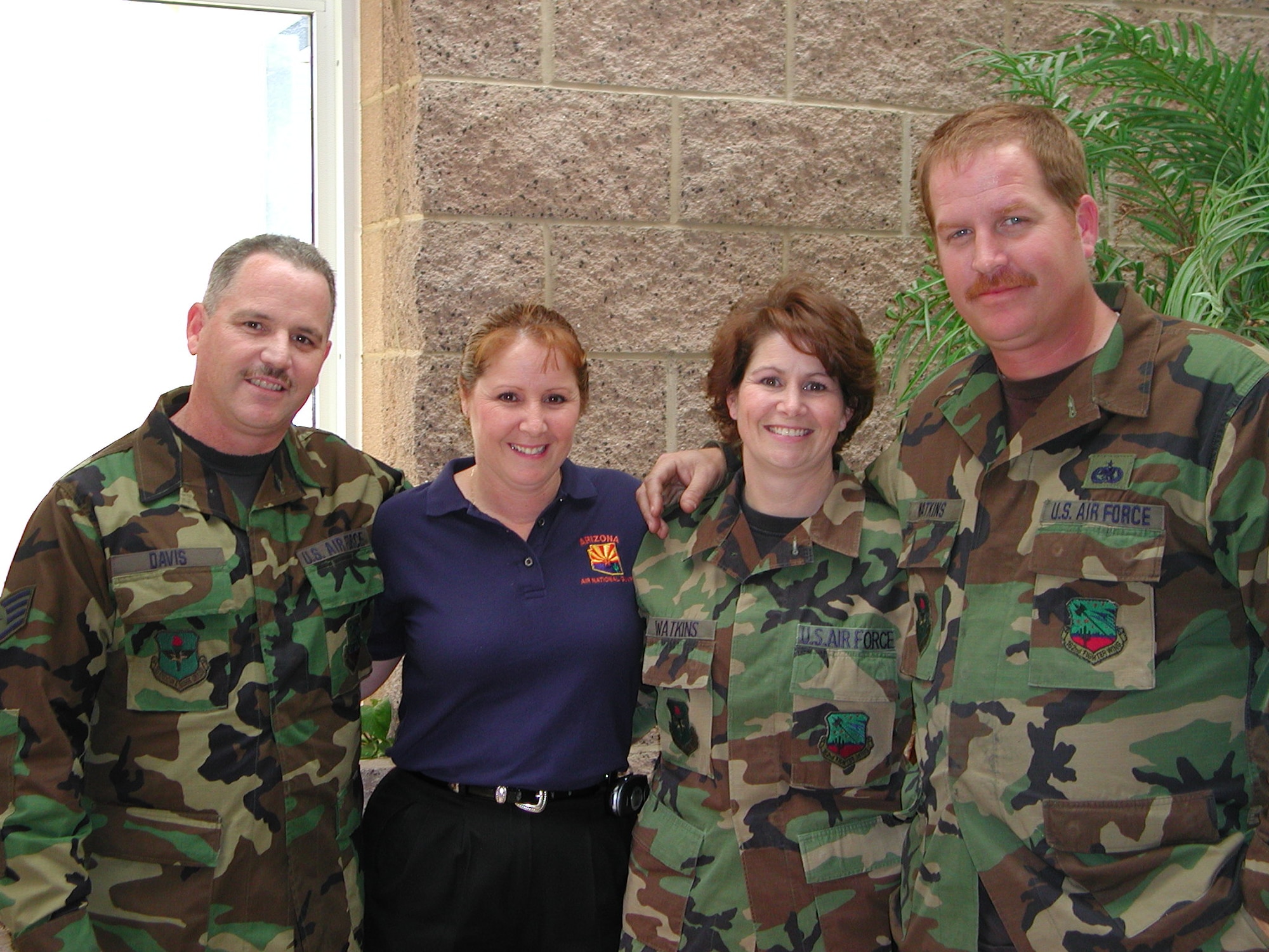Twins Staff Sgt. Travis Davis and Master Sgt. Teresa Denogean with their sister Master Sgt. Brandi Watkins and her husband Tech. Sgt. Jay Watkins. (Air National Guard photo by Staff Sgt. Ashley Karas)