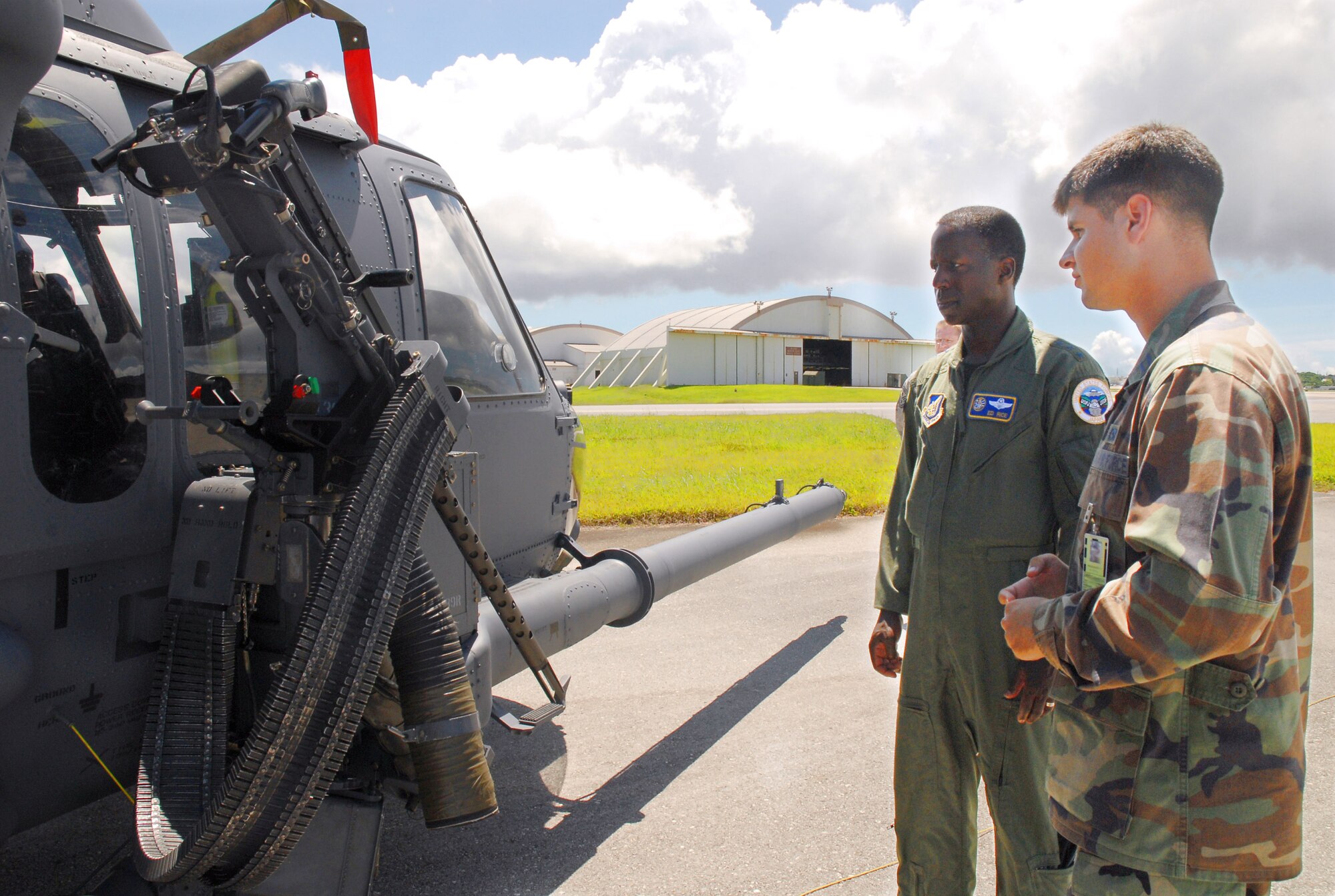 Lt. Gen. Edward A. Rice Jr. discusses the capabilities of the HH-60 Pave Hawk helicopter with Capt. Gerard Carisio during a June 20 tour of Kadena Air Base, Japan. General Rice is the commander of U.S. Forces Japan and 5th Air Force. Captain Carisio is the 33rd Aircraft Maintenance Unit officer in charge. (U.S. Air Force photo/Airman Chad Warren) 
