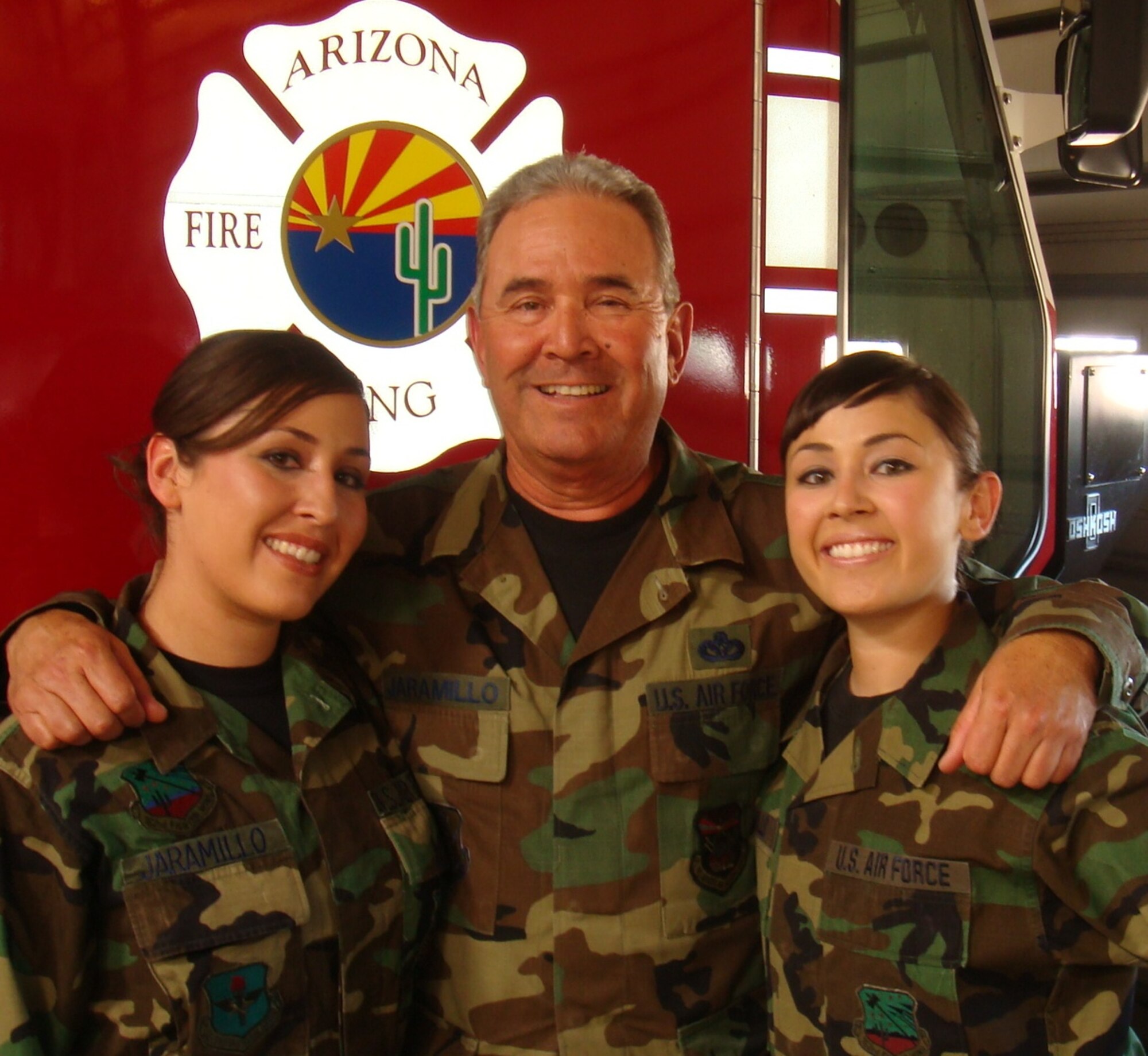 Staff Sgt. Erika Jaramillo, Chief Master Sgt. Bobby Jaramillo and Senior Airman Andrea Jaramillo. Both daughters joined the wing after their father served several
years here. Chief Jaramillo now serves at Arizona Joint Force Headquarters in Phoenix. (Air National Guard photo by Staff Sgt. Ashley Karas)