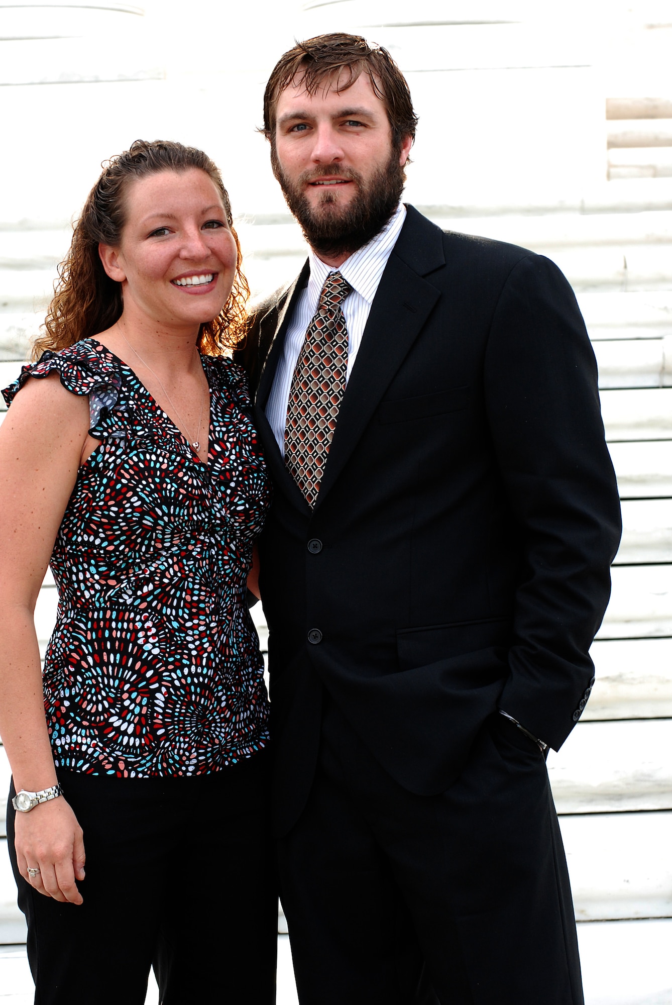 Staff Sgt. Scott Geisser, the Air National Guard's Noncommissioned Officer
of the Year, and his finance, Tara, visit the Tomb of the Unknowns at
Arlington National Cemetery June 16 during the Air Guard's Outstanding
Airmen of the Year week. As a combat controller preparing to deploy
overseas, Geisser was allowed to go unshaven and in a business suit during
the week's events June 15-20 in Washington. (Photo by Master Sgt. Mike R.
Smith, National Guard
Bureau)
