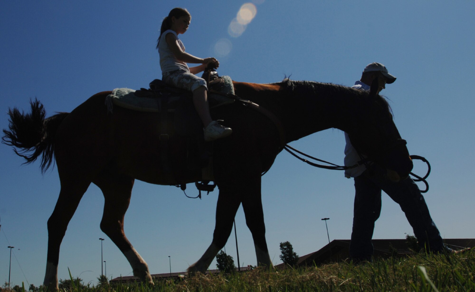 A young family member of the 931st Air Refueling Group rides a horse led by Tech. Sgt. Tyrel Askren, 931st Security Forces, at the Group's Family Day Picnic in 2007.  Volunteers are needed to support this year's picnic, scheduled for the September Unit Training Assembly. Contact Tech. Sgt. Shannan Hughes at 316-759-6082 for more information. (U.S. Air Force photo/Tech. Sgt. Jason Schaap)
