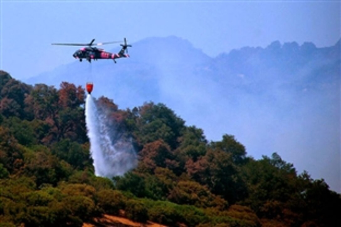 A helicopter from the California National Guard assists in firefighting efforts in Napa County, Calif., June 24, 2008. The fire was set by a series of lightning strikes that hit the area June 21, 2008.