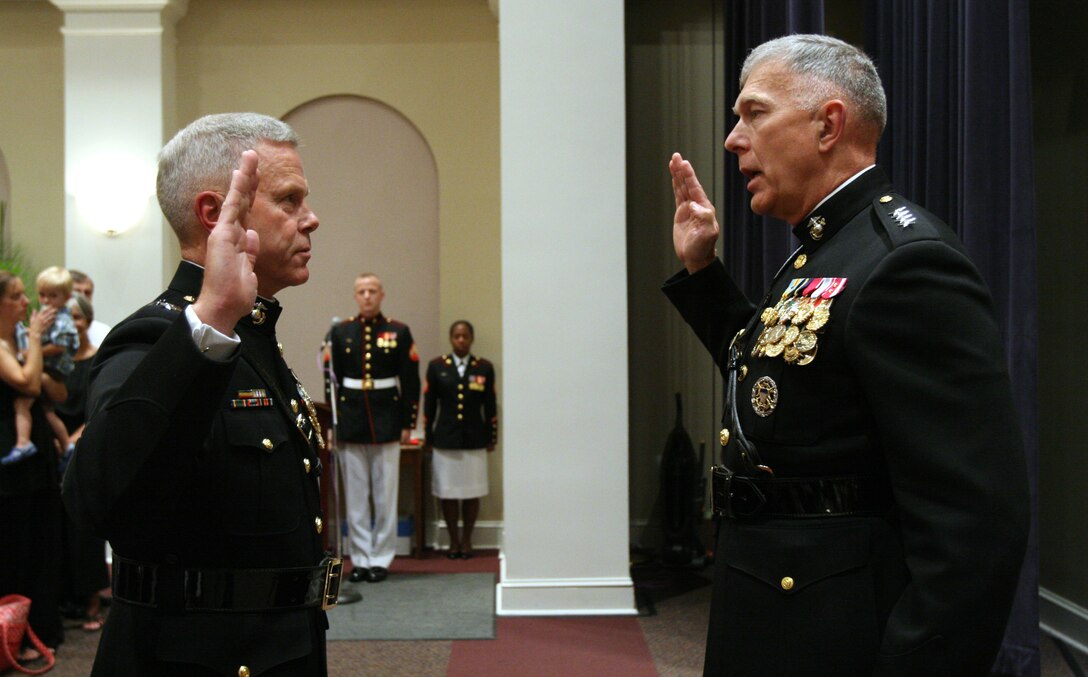 Gen. James T. Conway, commandant of the Marine Corps, right, promotes Lt. Gen. James F. Amos, formerly deputy commandant for combat development and integration, to general at Marine Barracks Washington July 2. Amos is slated to become assistant commandant July 8.