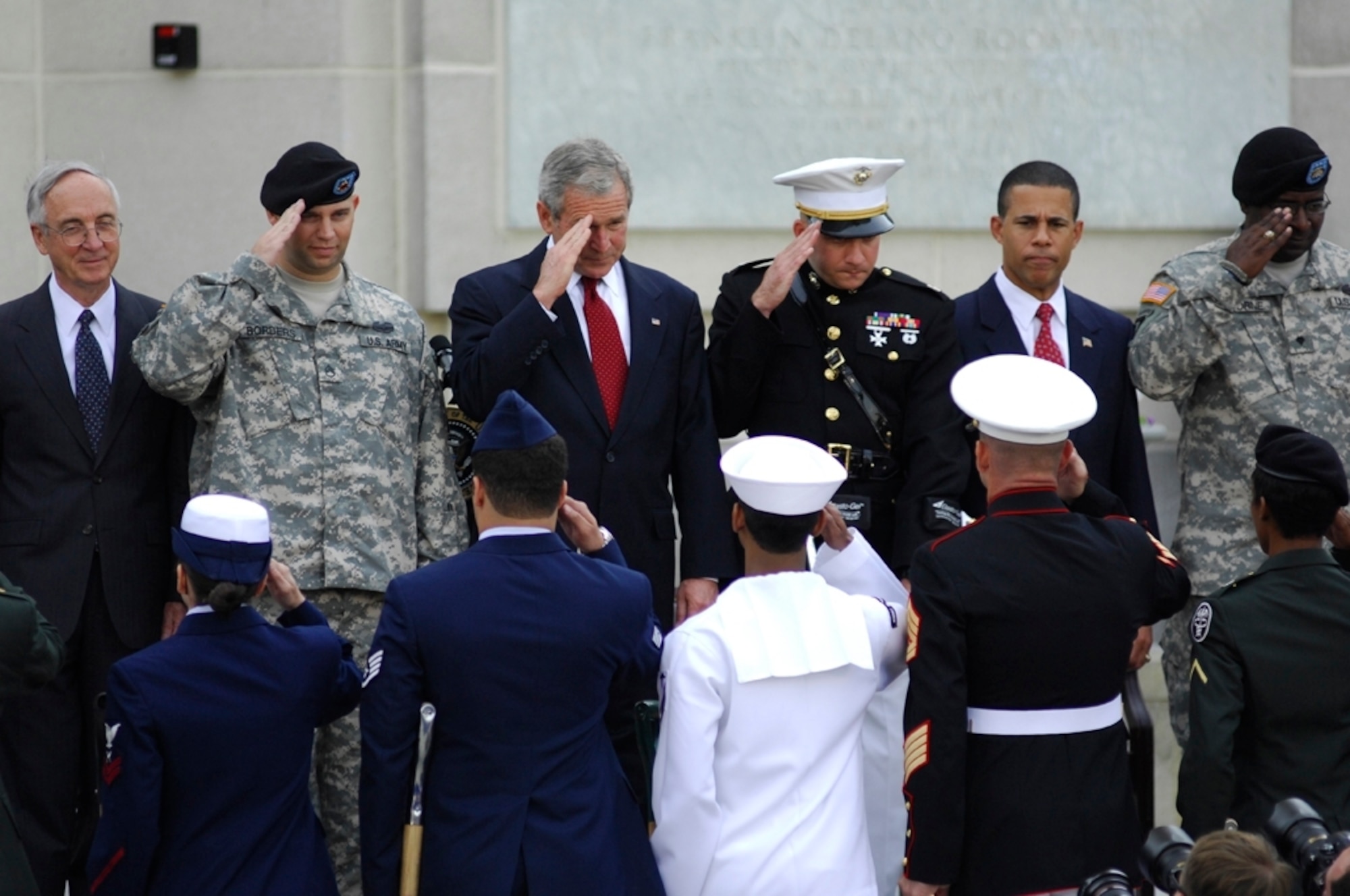 President George W. Bush leads a group of military and civilian leaders and wounded warriors in a salute during the Walter Reed National Military Medical Center groundbreaking ceremony at Bethesda Naval Hospital in Maryland, July 3. (U.S. Air Force photo/Tech. Sgt. Suzanne M. Day)
