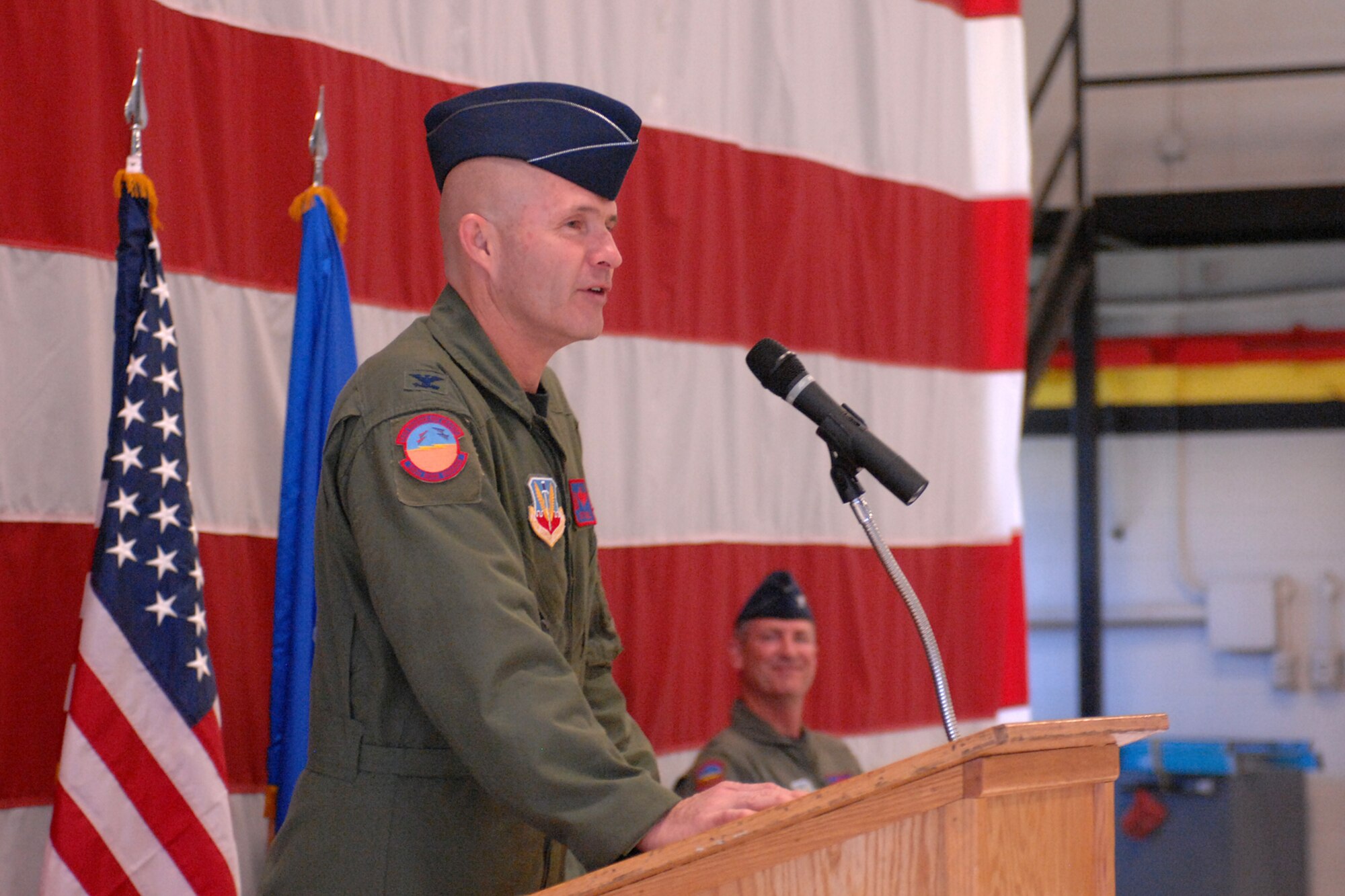 Col. Jeffrey Snell addresses the audience after accepting command of the 388th Range Squadron in a ceremony here June 19. The colonel will direct Department of Defense operations on the 2.3 million-acre Utah Test and Training Range and manage approximately 100 personnel.  The 388th Fighter Wing Commander, Col. Scott Dennis,  presided over the unit's change of command. (U.S. Air Force photo by Alex Lloyd)