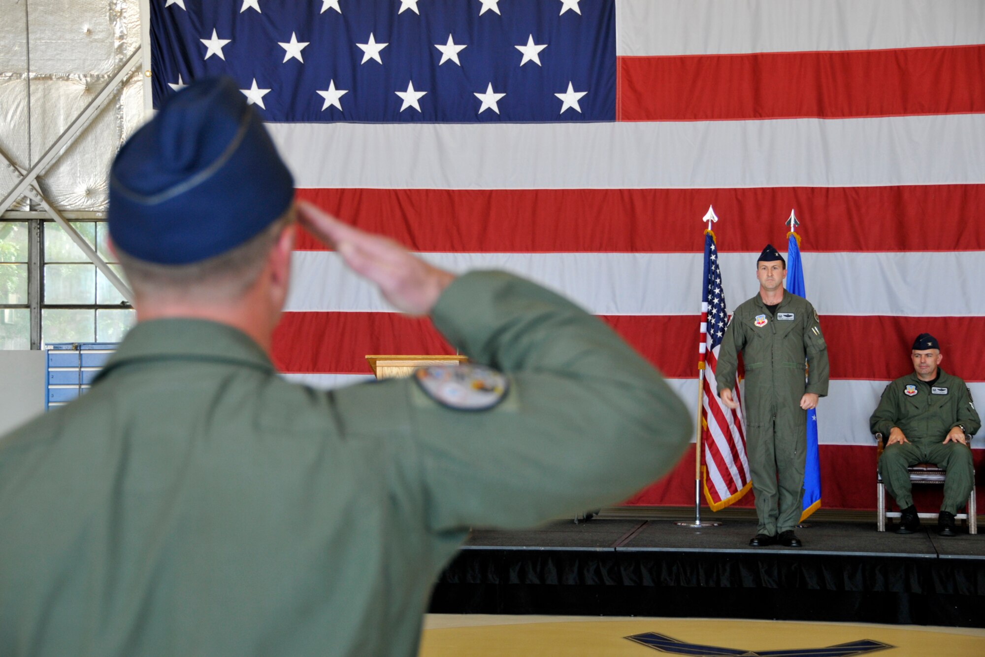 Col. Stephen Langford (center) accepts his first salute as commander of the 388th Operations Group in a ceremony here June 20. The colonel will direct the flying operations of three, frequently-deployed F-16 squadrons and approximately 200 pilots and support personnel. The 388th Fighter Wing Commander, Col. Scott Dennis,  presided over the unit's change of command. (U.S. Air Force photo by James Arrowood)