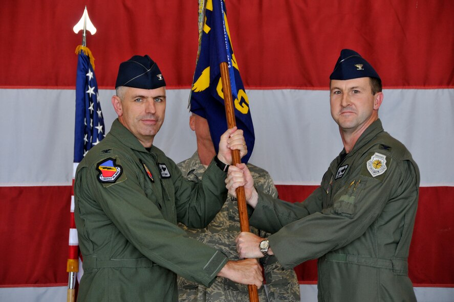 Col. Stephen Langford (right) accepts command of the 388th Operations Group in a ceremony here June 20. The colonel will direct the flying operations of three, frequently-deployed F-16 squadrons and approximately 200 pilots and support personnel. The 388th Fighter Wing Commander, Col. Scott Dennis (left), presided over the unit's change of command. (U.S. Air Force photo by James Arrowood)