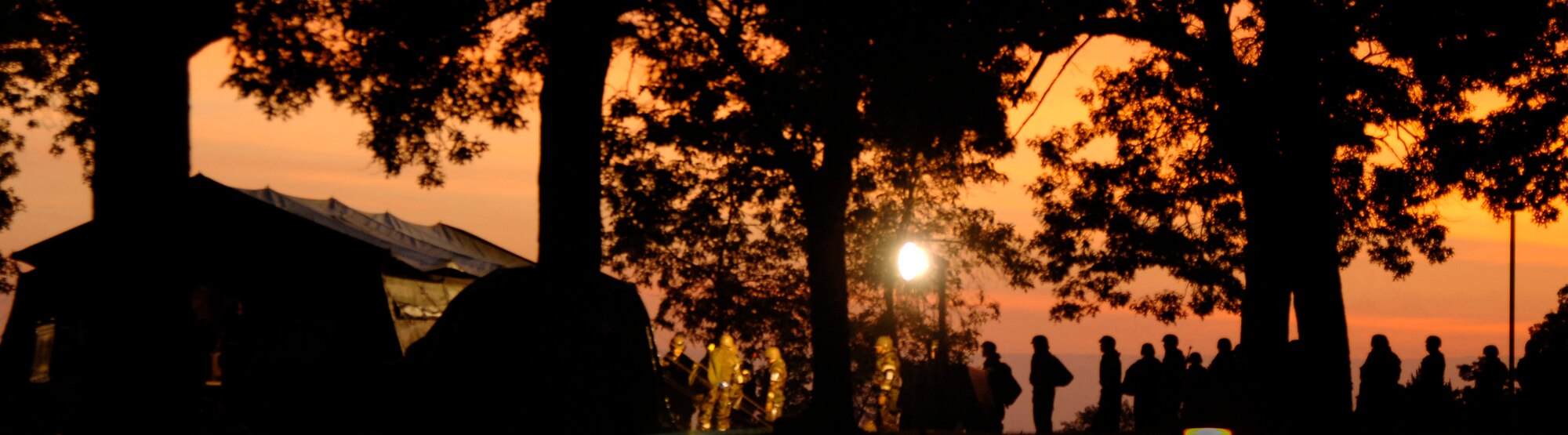 Airmen wait early in the morning for breakfast at an Operational Readiness Inspection at Volk Field Air National Guard Base, Wis., on June 27,  Breakfast was served in a tent because the dining facility was closed following a simulated request from a host nation. (U.S. Air Force photo/Senior Airman Laura Suttles)