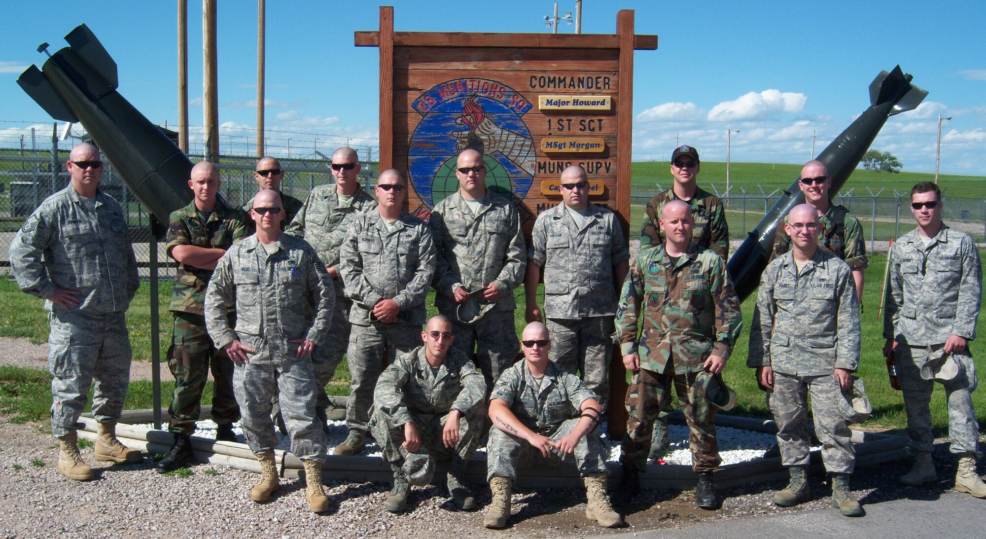 Fourteen members of the 28th Munitions Squadron munitions storage shop shaved their heads after finding out a fellow Airman's mother was diagnosed with breast cancer and undergoing chemotherapy. Their show of support reinforced the unit's devotion to brotherhood and camaraderie. (Courtesy photo/28 MUNS)