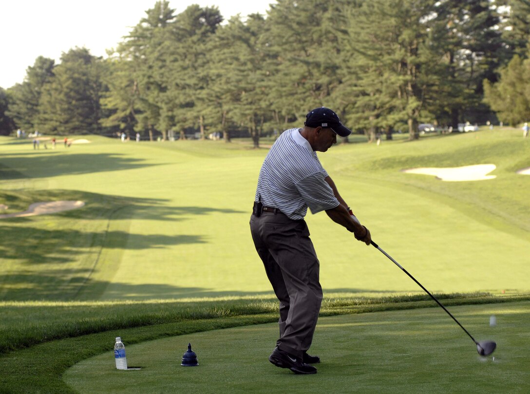 Senior Master Sgt. Kirk Kessler tees off during the 2nd Annual AT&T National Golf Tournament July 2 at the Congressional Country Club in Bethesda, Md. The Tiger Woods Foundation selected Sergeant Kessler to play in the tournament. Sergeant Kessler is assigned to the 316th Civil Engineer Squadron from Andrews Air Force Base, Md. (U.S. Air Force photo/Senior Airman Steven R. Doty) 
