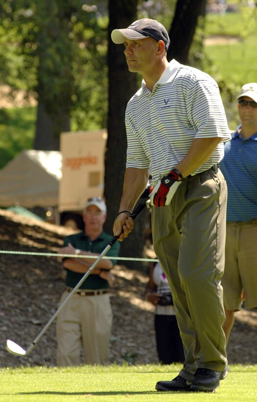 Senior Master Sgt. Kirk Kessler lines up his shot during the 2nd Annual AT&T National Golf Tournament July 2 at the Congressional Country Club in Bethesda, Md. The Tiger Woods Foundation selected Sergeant Kessler to play in the tournament. Sergeant Kessler is assigned to the 316th Civil Engineer Squadron from Andrews Air Force Base, Md. (U.S. Air Force photo/Senior Airman Steven R. Doty) 
