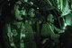 Night time training is critical to the success of the Air Mobility Command. After their mission was complete, this aircrew from the 156th Airlift Squadron shows what the cockpit looks like when they are using their night vision goggles (NVGs) The C-130 they are flying is assigned to the 145th Airlift Wing, North Carolina Air National Guard. Released. Photo by Staff Sgt. Richard M. Kerner N.C. Air National Guard