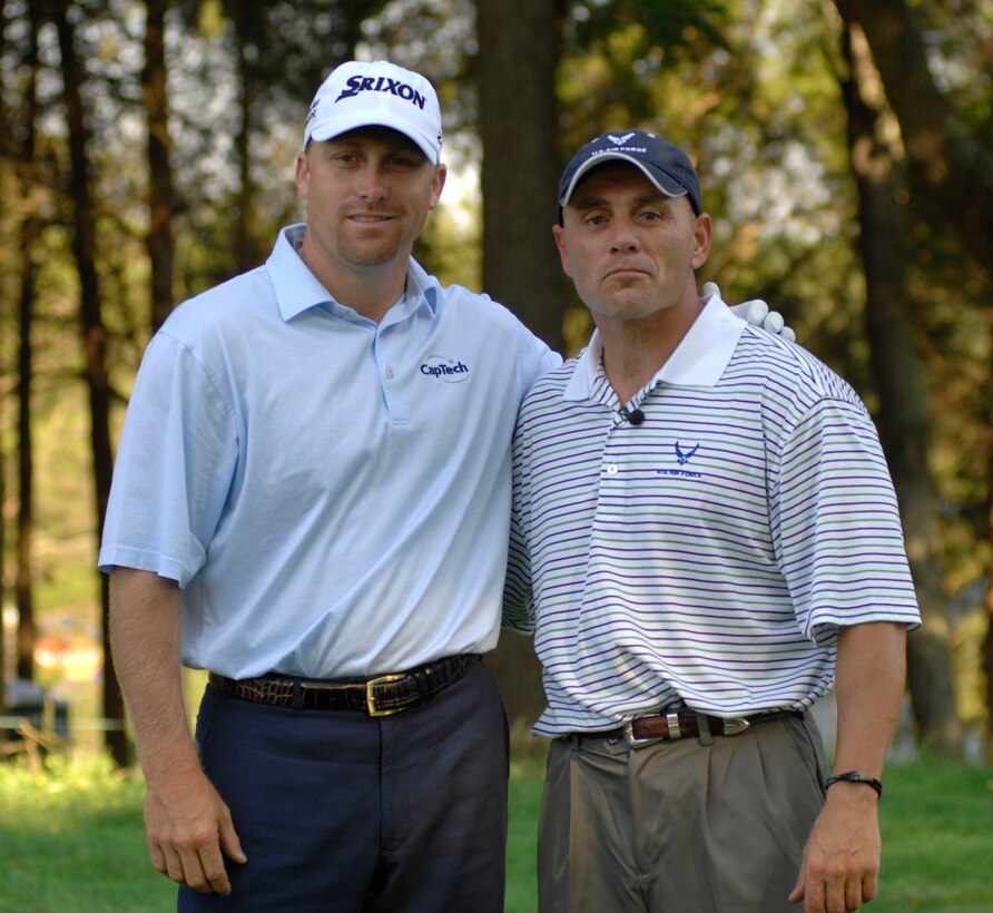 Senior Master Sgt. Kirk Kessler (right), 316th Civil Engineer Squadron, poses with pro golfer John Rollins during the 2nd Annual AT&T National golf tournament July 2. The Tiger Woods Foundation selected Sergeant Kessler to play in the 2nd Annual AT&T National golf tournament at the Congressional Country Club, Bethesda, MD.  (U.S. Air Force photo/Senior Airman Steven R. Doty)