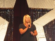 Allison Hollis sings "His Eyes on the Sparrow" to a crowd of approximately 800 during the Lackland Idol contest June 27.  Ms. Hollis won first place. (USAF photo by Zuhal Rick)  