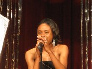 Staff Sgt. Tiffany Hill, 59th Medical Logistics and Readiness Squadron, sings "No One" during the Lackland Idol contest June 27.  Sergeant Hill placed third. (USAF photo by Zuhal Rick)   