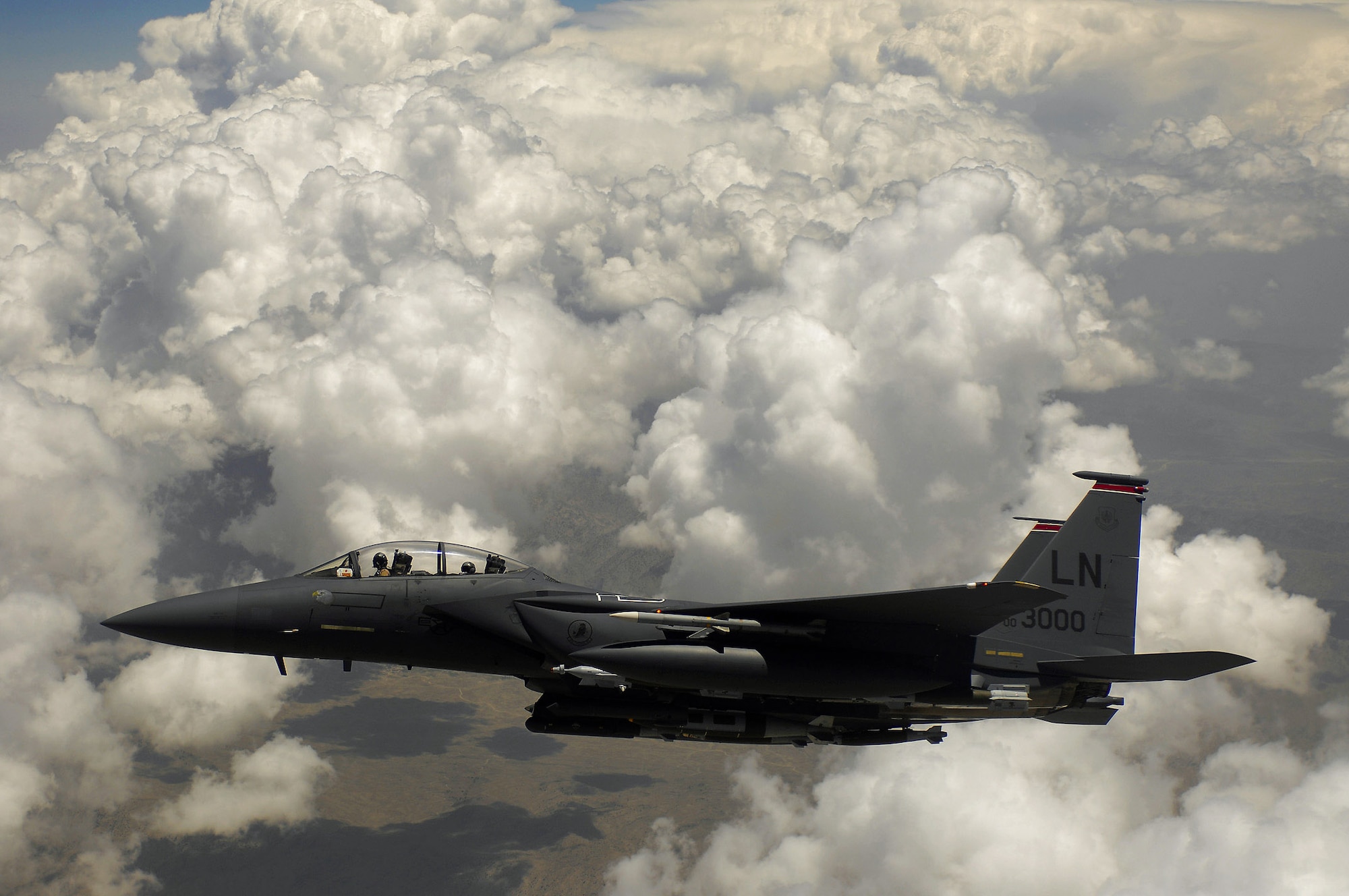 An Air Force F-15E Strike Eagle waits for his wingman after receiving fuel during a mission over Afghanistan. F-15Es used GBU-31 and GBU-38s to deter anti-Afghan forces fighting positions. (U.S. Air Force photo/Master Sgt. Andy Dunaway)
