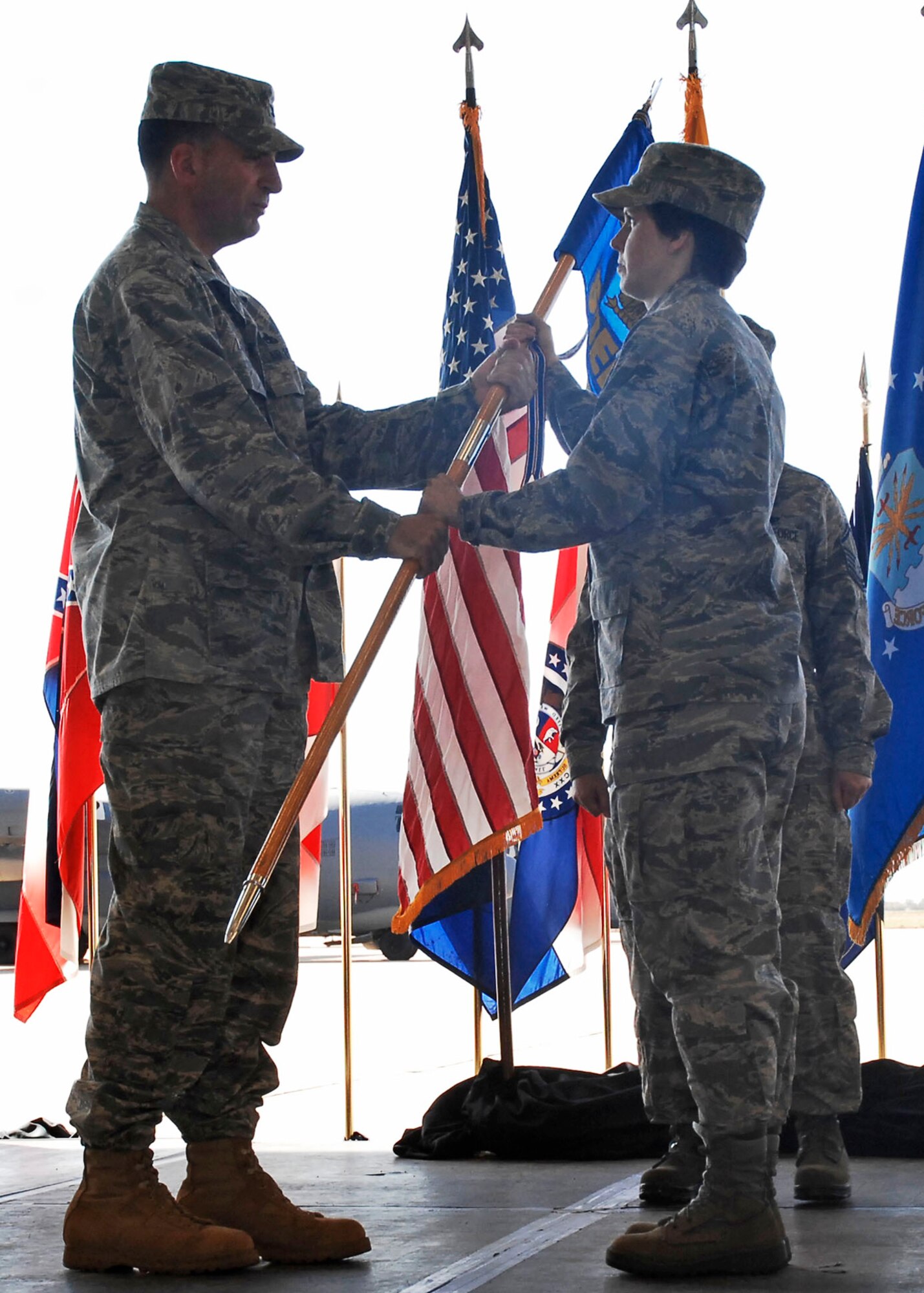 CANNON AIR FORCE BASE, N.M. -- Col. Mark LaRose, (left) 27th Special Operations Maintenance Group commander, gives Maj. Michelle Estes (right) command of the 27th Special Operations Equipment Maintenance  Squadron on July 2. Major Estes replaced outgoing commander Maj. James Rich.  (US Air Force photo by Airman 1st Class Danielle Martin) 