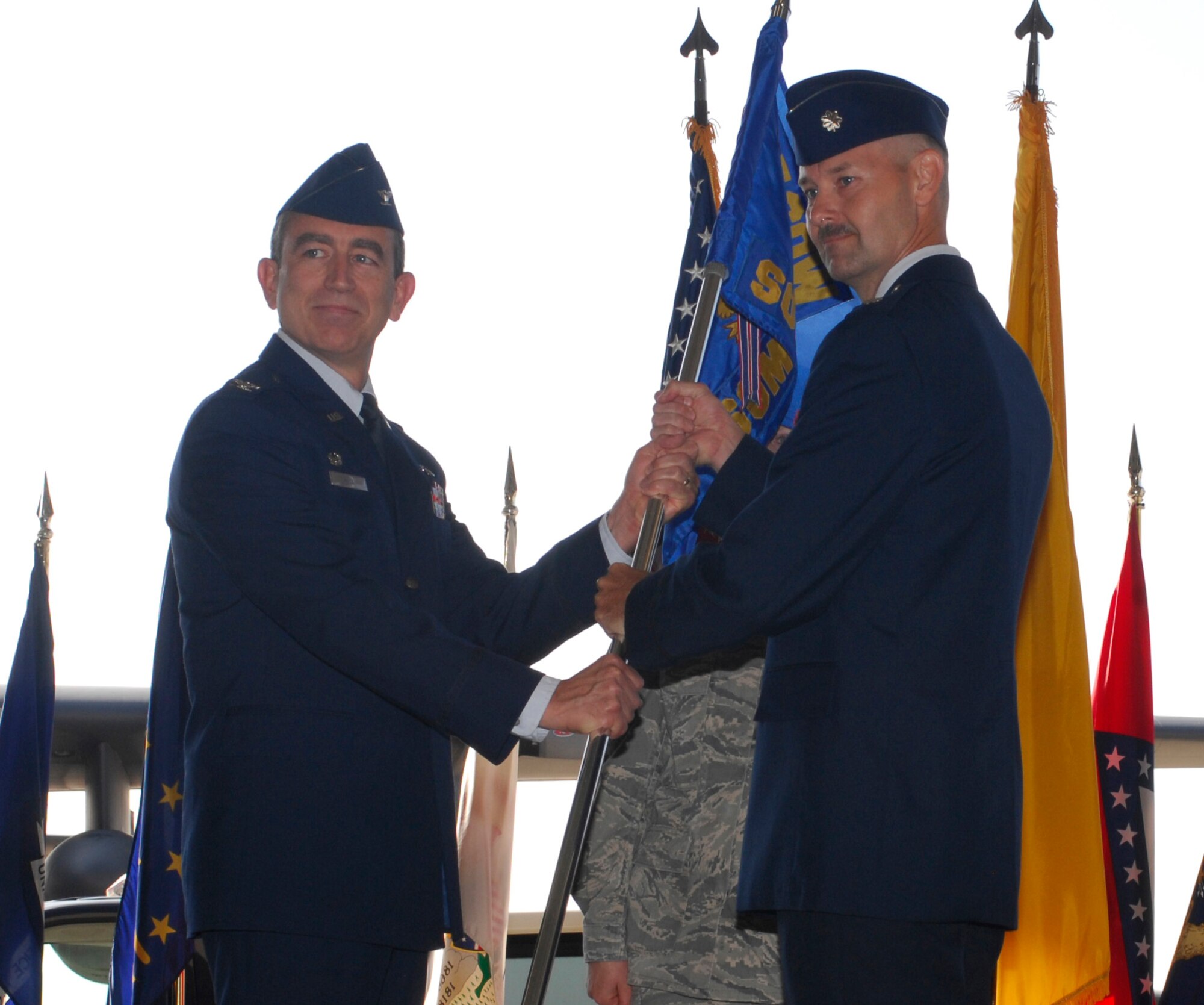 CANNON AIR FORCE BASE, N.M. - Lt. Col. James Reineke assumes command of the 27th Special Operations Medical Operations Squadron from Col. Kenneth Hall, 27th Special Operations Medical Group commander, in a change-of-command ceremony July 1. Col. Maria Buckles relinquished command of the 27th SOMDOS. (U.S. Air Force photo/Airman 1st Class James Bell)