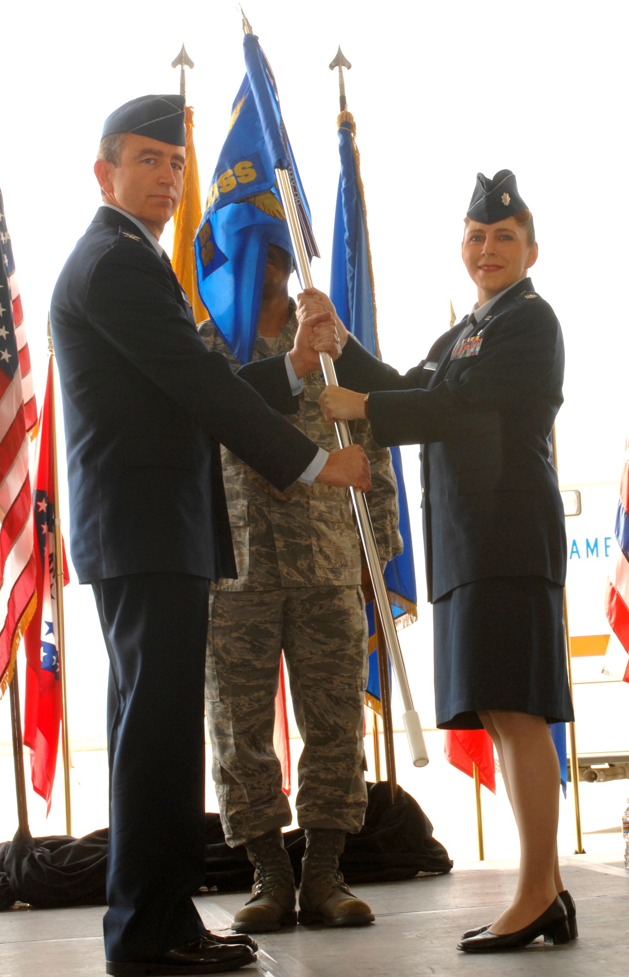 CANNON AIR FORCE BASE, N.M. -- Lt. Col. Michelle Pufall accepts the colors and  assumes command of the 27th Special Operations Medical Support Squadron from Col. Kenneth Hall, 27 Special Operations Medical Group commander. Colonel Pufall replaced  Lt. Col. Michael Dietz on July 1. (U.S. Air Force photo/Airman 1st Class James Bell)
