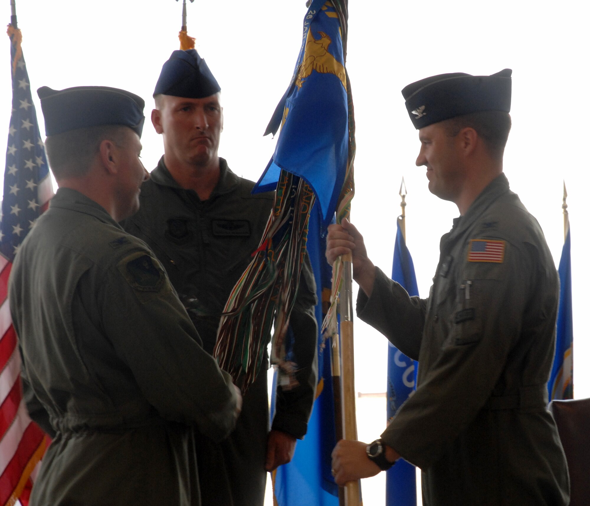 CANNON AIR FORCE BASE, N.M. -- Col. James Cardosa (right) receives the 27th Special Operations Group guidon from Col.Timothy Leahy, 27th Special Operations Wing commander, in a change-of-command ceremony July 1. Col. Michael Plehn relinquished command of the 27th SOG. (U.S. Air Force photo/Airman 1st Class Evelyn Chavez) 