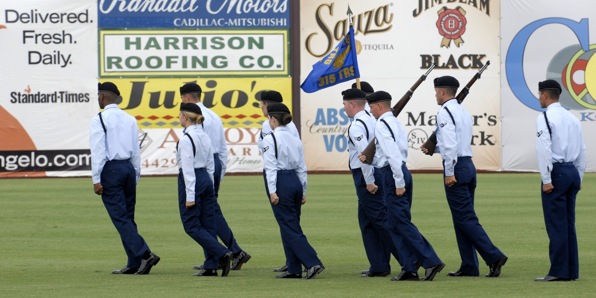 The 315th Training Squadron Black Rope Precision Drill Team performs a drill routine at the San Angelo Colts baseball game June 30. (U.S. Air Force photo by Master Sgt. Randy Mallard)