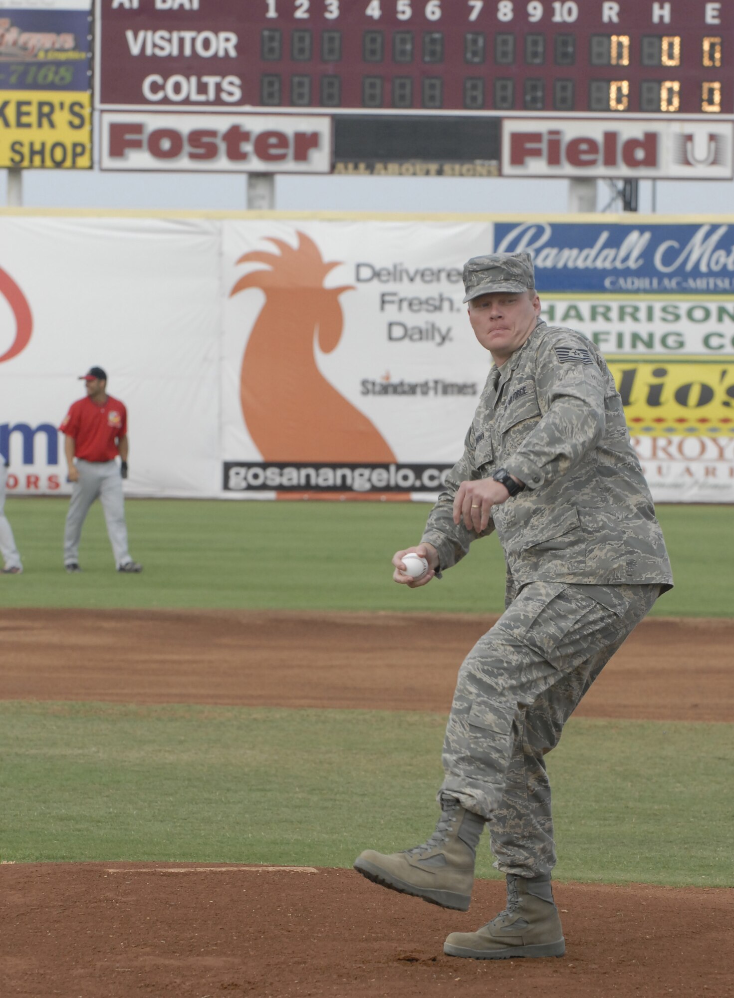 Technical Sergeant Dorian Chapman, a recent war returnee stationed at Goodfellow, throws out the first pitch at the San Angelo Colts baseball game June 30. (U.S. Air Force photo by Master Sgt. Randy Mallard)