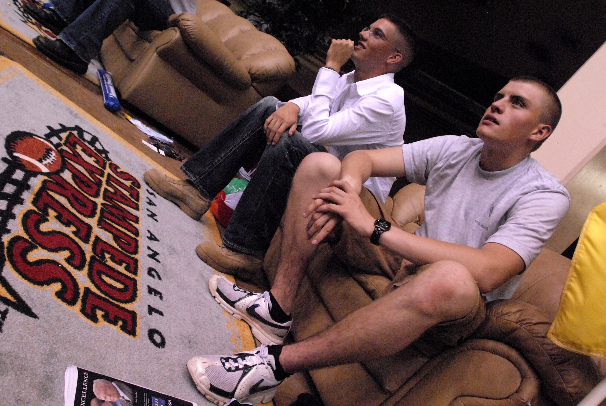 Airmen Basic Christopher Van Volkenburg and Joshua Brown watch the San Angelo Stampede Express football game from the best seats in town. (U.S. Air Force photo by Master Sgt. Randy Mallard)