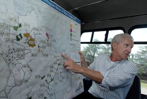 LANGLEY AIR FORCE BASE, Va – Mr. John Tice, 1st Civil Engineer Squadron environmental restoration chief, explains the cleanup process of Langley’s Landfill 17 to Col. Kevin Altman, 1st Mission Support Group commander, during a monthly base civil engineer update here July 2. The restoration process began in the spring and is scheduled for completion in October 2008. (U.S. Air Force photo/Senior Airman Vernon Young)
