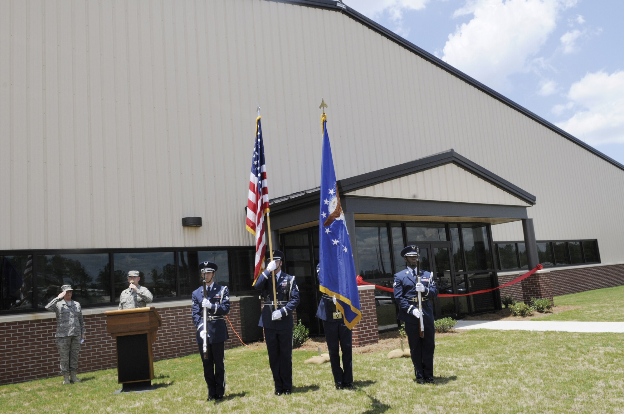 Robins honor guard presents the colors for the singing of the national anthem at the ribbon cutting ceremony for the 5th Combat Communications Group operations Support facility June 27. U. S. Air Force photo by Sue Sapp