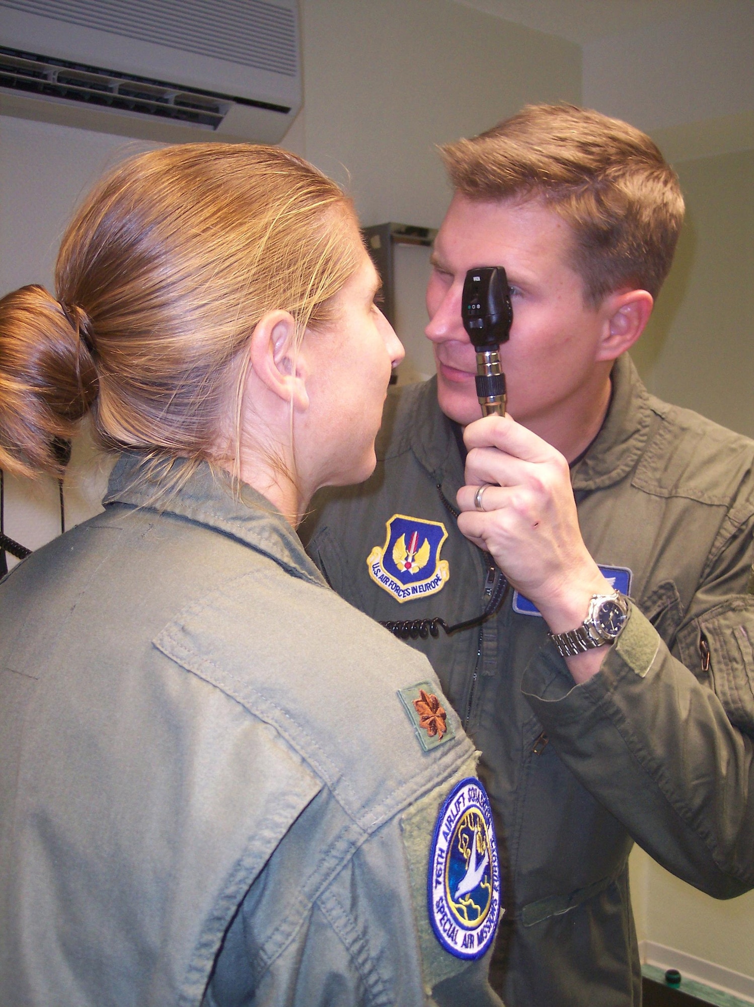 Maj. (Dr.) Mac Dunn, 435th Aerospace Medical Squadron chief of aerospace medicine, performs and eye exam on a patient. (Courtesy Photo)
