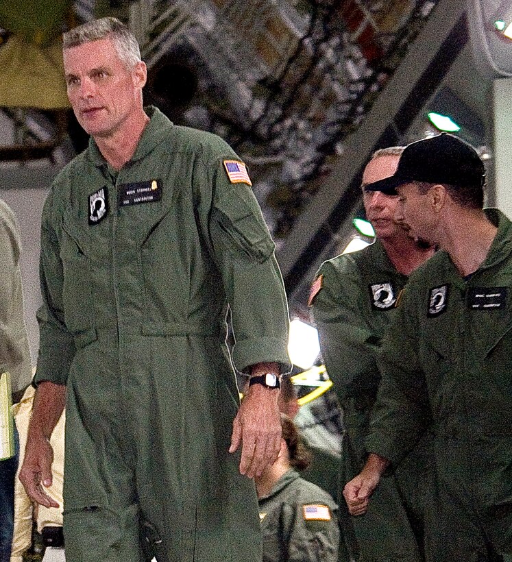 Keith Stansell, left, Marc Gonsalves, center, and Thomas Howes prepare to walk off a U.S. Air Force C-17 Globemaster III as they arrive on Lackland Air Force Base, Texas, July 2, 2008. The three were held as hostages in Colombia for more than five years, after their plane crashed in the jungle in February 2003.