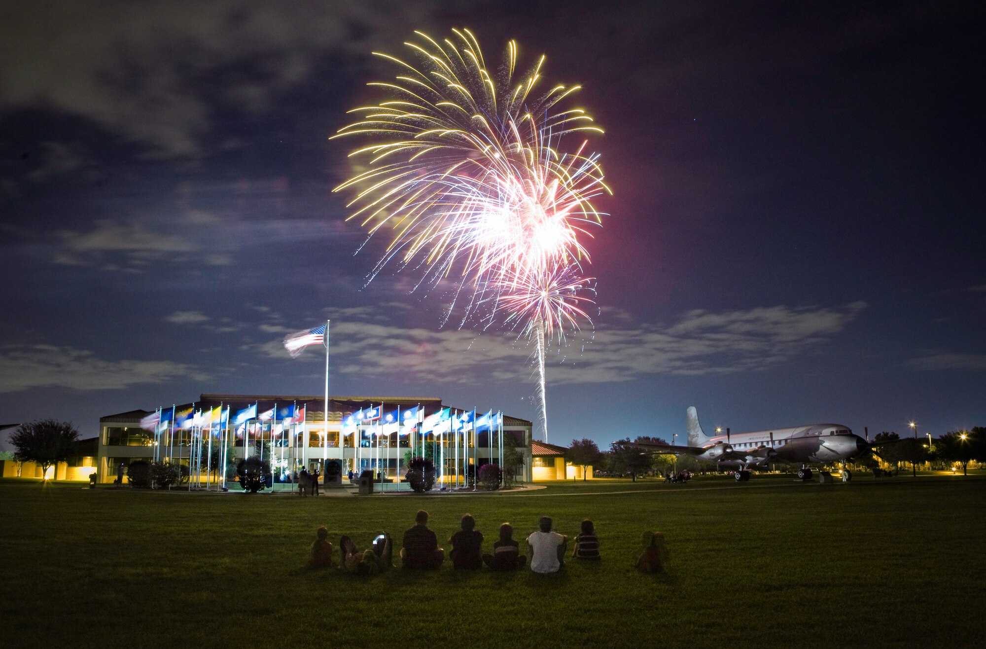 The Rains Family viewed the Fourth of July fireworks display from the parade grounds near the 37th Training Wing headquarters building at Lackland Air Force Base, Texas.  Lackland celebrated its 30th Star Spangled Festival July 4 with  military and public communities by hosting activities and events, including live entertainment, a children's carnival, contests and exhibitions. The activities were at the Lackland Amphitheater Grounds. (U.S. Air Force photo/Lance Cheung)