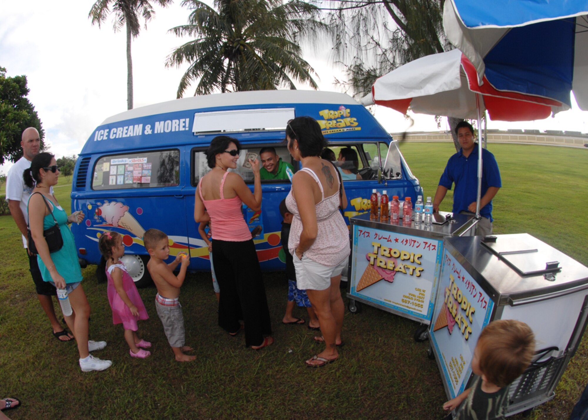 People from around the base line up to buy a frozen treat from the ice cream man during freedom fest at Arc Light Park here July 3. Freedom Fest is hosted by the 36th Force Support Squadron and held annually to recognize and celebrate our Independence Day. (U.S. Air Force photo by Airman 1st Class Nichelle Griffiths)