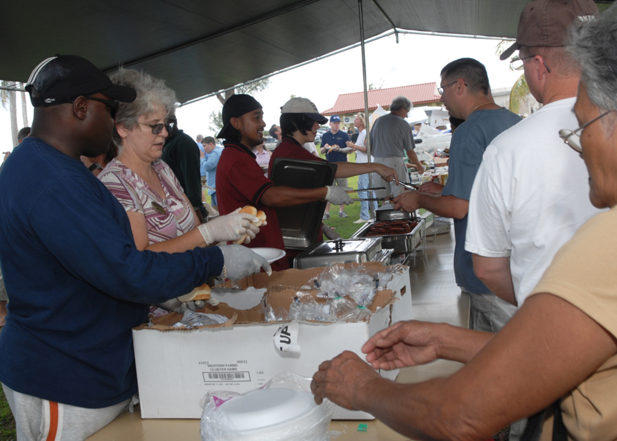 The 36th Force Support Squadron serve free hot dogs, hanbugers, and chips during Freedom Fest at Arc Light Park here July 3. Freedom Fest is hosted by the 36th Force Support Squadron and held annually to recognize and celebrate our Independence Day. (U.S. Air Force photo by Airman 1st Class Nichelle Griffiths)