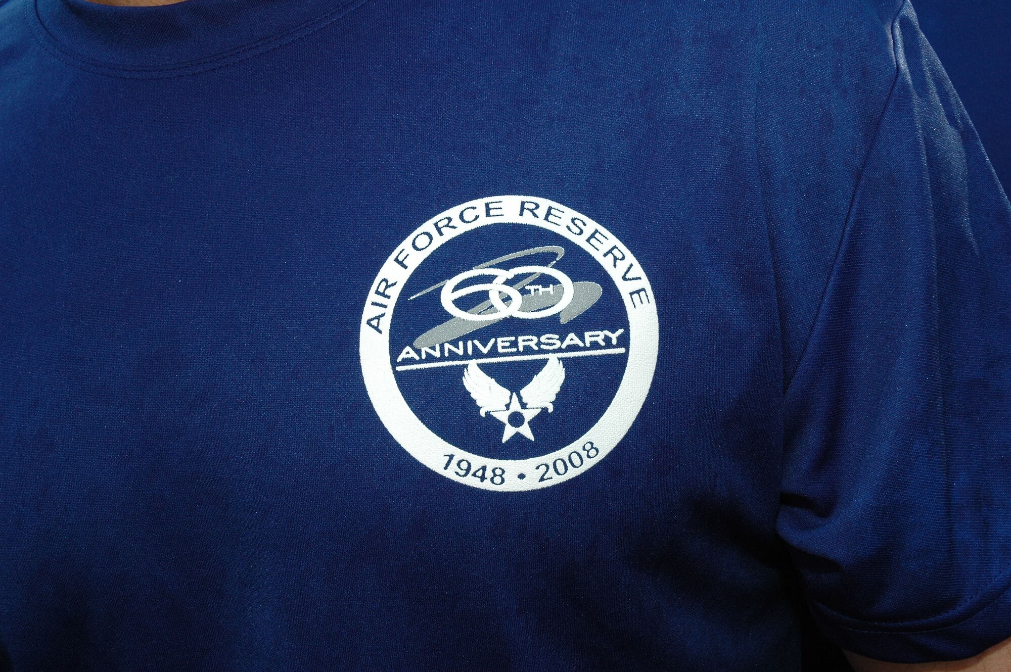 The Dobbins Air Reserve Base running team's T-shirt was designed in honor of the 60th Anniversary of the Air Force Reserve. It displays the Air Force Reserve Command 60th Anniversary logo and the U.S. Air Force Symbol. (U.S. Air Force photo/Master Sgt. Stan Coleman)