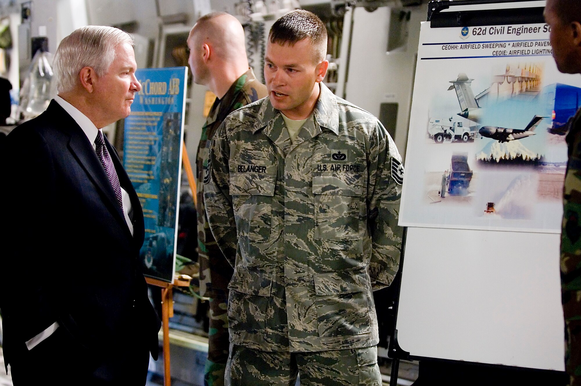 Tech. Sgt. David Belanger, 62nd Civil Engineer Squadron, conducts an airfield maintenance brief for Secretary of Defense Robert M. Gates during a static display tour inside a C-17 Globemaster III here Monday.  (U.S. Air Force photo/Abner Guzman)