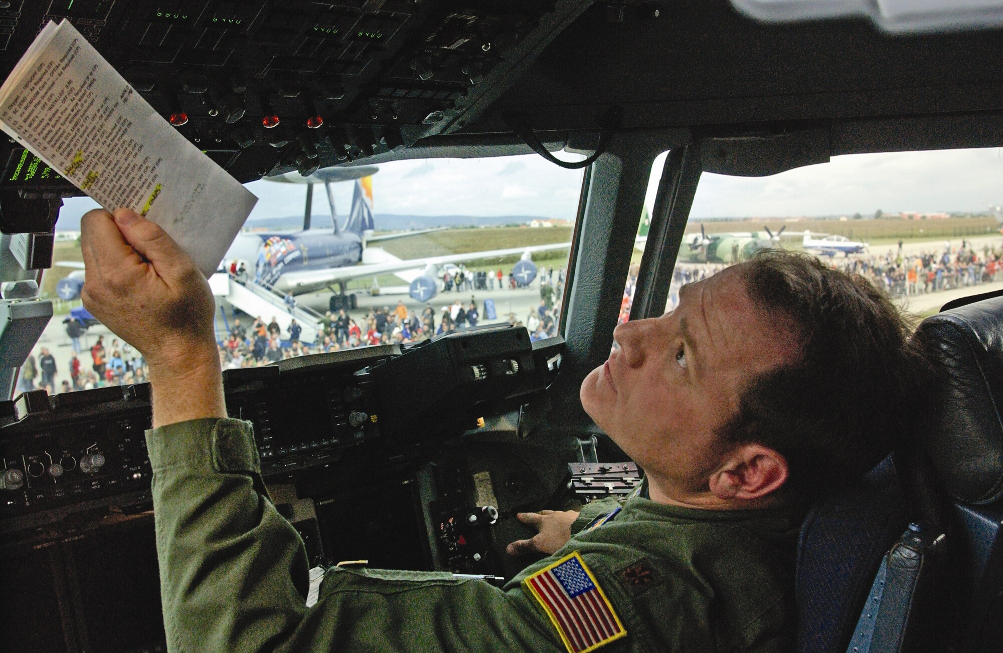 Maj. Dan Nichols, an evaluator pilot with the 729th Airlift Squadron, performs a preflight check before an aerial demonstration during an air show in the Czech Republic. He helped to create tactics, techniques and procedures for the C-17. (U.S. Air Force photo by Senior Airman David K. Flaherty)