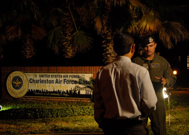 Hatzel Vela interviews Staff Sgt. Bryan Ball at Charleston AFB after a flight from Colombia July 3. The C-17 crew Sergeant Ball was with assisted in the release of three Americans being held as prisoners by the Revolutionary Armed Forces in Colombia for five years. Mr. Vela is a reporter for Live 5 News and Sergeant Ball is a raven for the 437th Security Forces Squadron. (U.S. Air Force photo/Airman 1st Class Cynthia Spalding)
