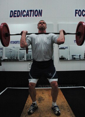 NIAGARA FALLS ARS, NY-- Capt. Thomas Tryon a C-130 pilot with the 328th Airlift Squadron trains for his next weightlifting competition by practicing his cleans and jerks in the base gym  during his down time after a Unit Training Assembly (U.S. Air Force photo by Airman Andrew Caya)