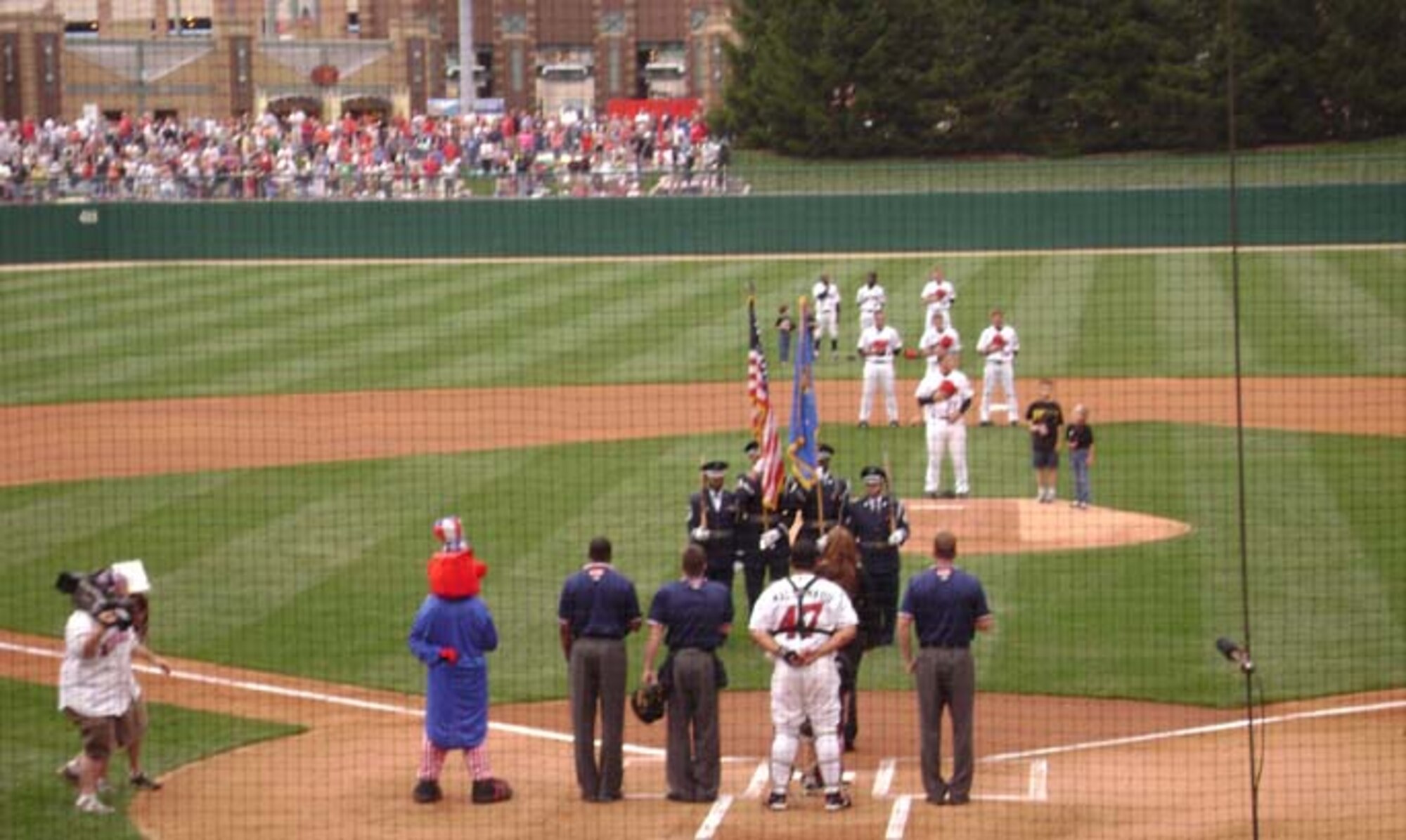 INDIANAPOLIS, Ind., -- Members of the Grissom Air Reserve Base Honor Guard take part in the opening ceremony at a recent Indianapolis Indians baseball game.  The Honor Guard travels throughout the state and participates in numerous civic and community events as part of the base's outreach program.  (U.S. Air Force photo/Chief Master Sgt. Jeff Mercier)                             