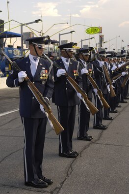 The U.S. Air Force Honor Guard Drill Team performs for racing fans July 5 for the Coke Zero 400 at the Daytona International Speedway in Daytona Beach, Fla. The drill team is the traveling component of the Honor Guard and tours worldwide representing all Airmen while showcasing Air Force precision. (U.S. Air Force photo by Airman 1st Class Sean Adams)