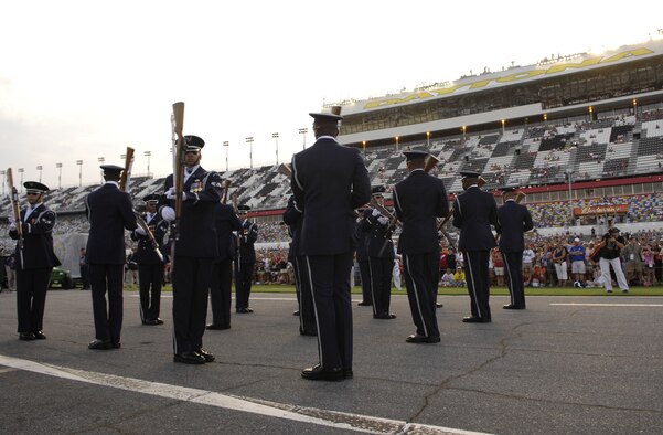 The U.S. Air Force Honor Guard Drill Team performs for racing fans July 5 for the Coke Zero 400 at the Daytona International Speedway in Daytona Beach, Fla. The drill team is the traveling component of the Honor Guard and tours worldwide representing all Airmen while showcasing Air Force precision. (U.S. Air Force photo by Airman 1st Class Sean Adams)