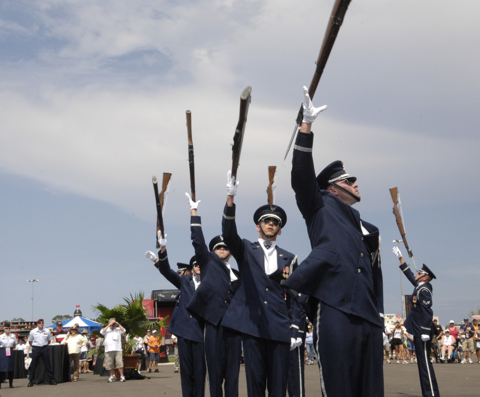 The U.S. Air Force Honor Guard Drill Team performs for racing fans July 5 for the Coke Zero 400 at the Daytona International Speedway in Daytona Beach, Fla. The drill team is the traveling component of the Honor Guard and tours worldwide representing all Airmen while showcasing Air Force precision. (U.S. Air Force photo by Airman 1st Class Sean Adams)
