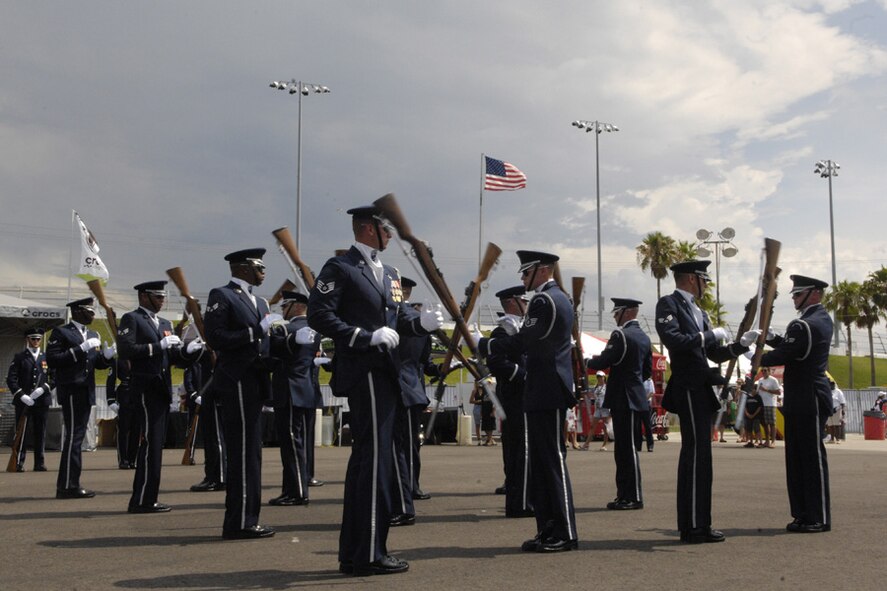 The U.S. Air Force Honor Guard Drill Team performs for racing fans July 5 for the Coke Zero 400 at the Daytona International Speedway in Daytona Beach, Fla. The drill team is the traveling component of the Honor Guard and tours worldwide representing all Airmen while showcasing Air Force precision. (U.S. Air Force photo by Airman 1st Class Sean Adams)