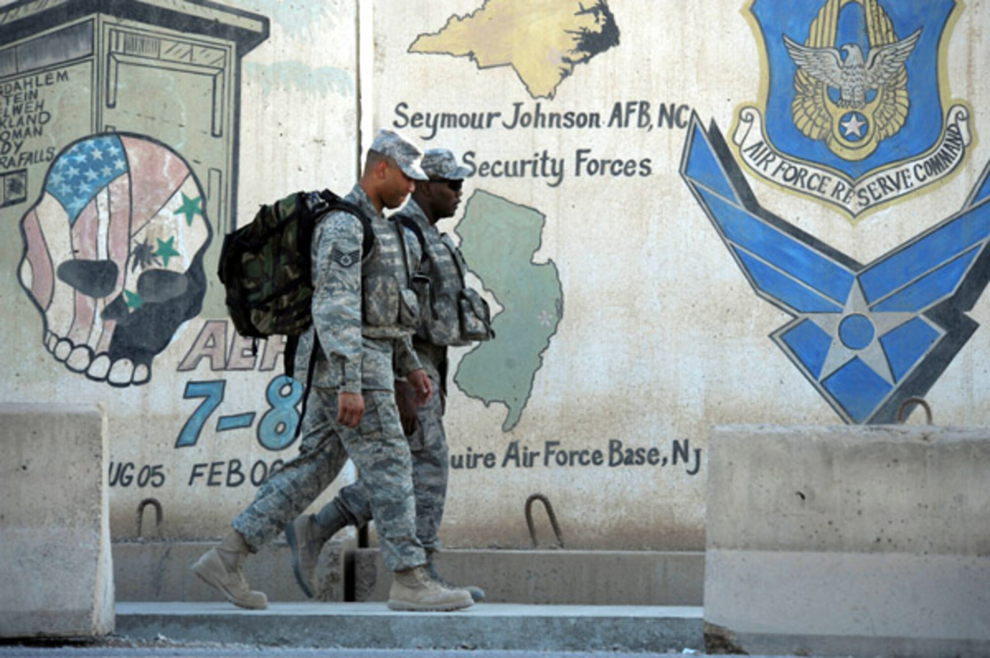 Staff Sgt. Jermaine Golden and Senior Airman Ronald Osborne, Security Forces members from the 507th Air Refueling Wing prepare to report for duty while deployed to Kirkuk AB, Iraq. The Wing’s security forces deployed earlier this year and are expected to return in late July.  Golden is a new father with a new child born last month while he was deployed.