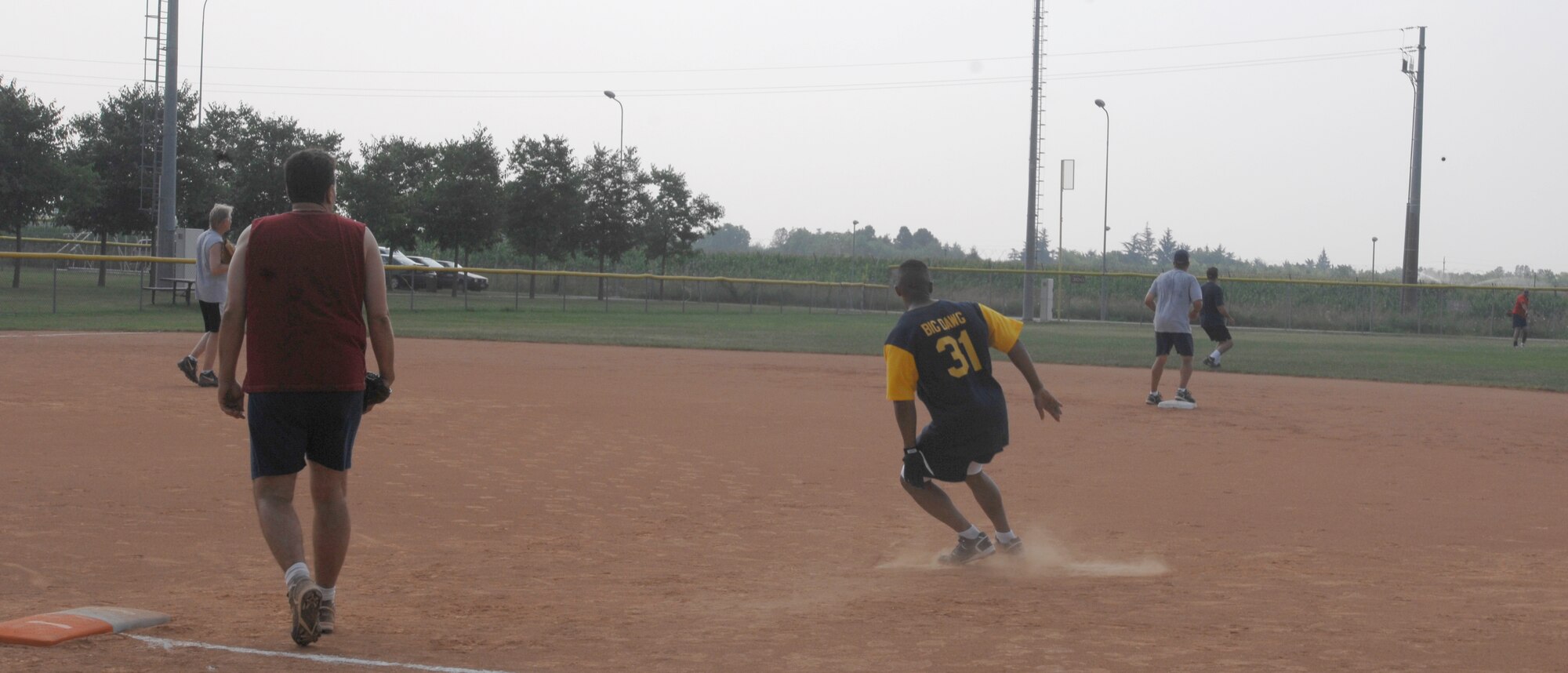 Eagles Victor Moncrieffe runs back to first base to avoid a double play during the Eagles versus Chiefs softball tournament on Aviano Air Base.  (U.S. Air Force photo/Airman 1st Class Ashley Wood)