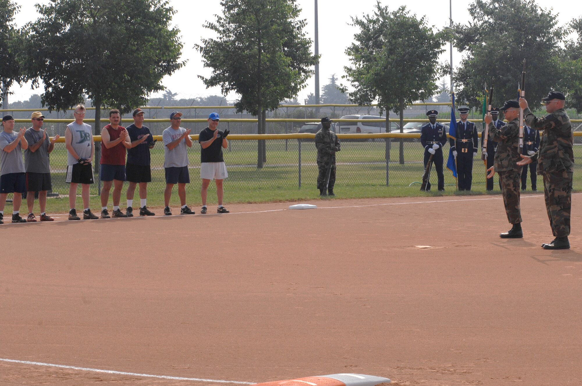 The Aviano Air Base Honor Guard and Drill Team perform before the Eagles vs Chiefs softball tournament July 4.  (U.S. Air Force photo/Airman 1st Class Ashley Wood)