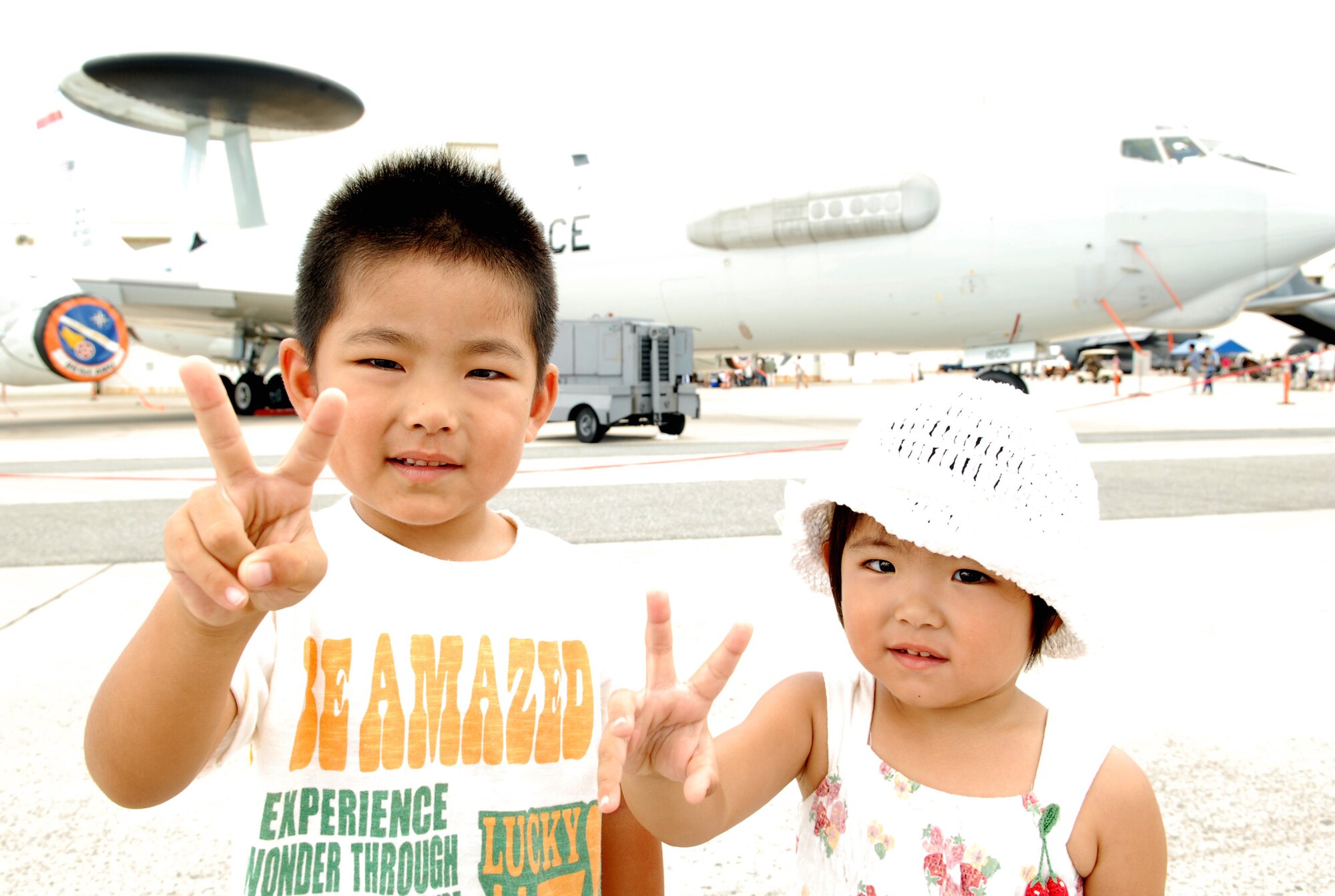 Nagamine Shion and his sister Rino enjoy the static displays at AmericaFest, July 5, Kadena Air Base, Japan. AmericaFest featured two dozen aircraft static displays, live entertainment, activities for children and a nightly fireworks show. The two-day event, which was designed to strengthen relations with the base's Okinawan neighbors, drew nearly 66,000 people.
(Photo/Junko Kinjo)      